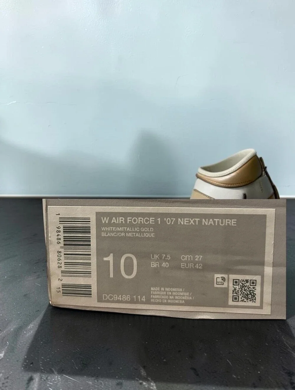 Nike Leather Low-Top Sneaker - White with Gold Swoosh